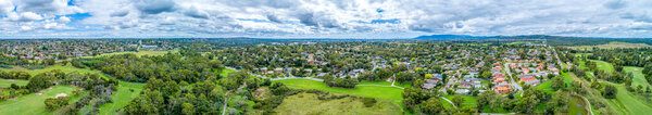Ultra wide aerial panorama of Dandenong North suburb and parklands in Melbourne, Australia