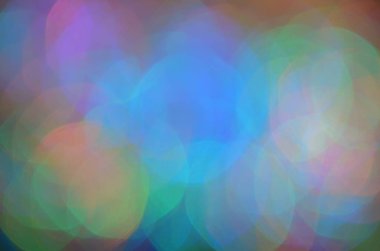 Parlak soyut arkaplan, şenlikli sönmüş ışıklar, renkli bokeh.