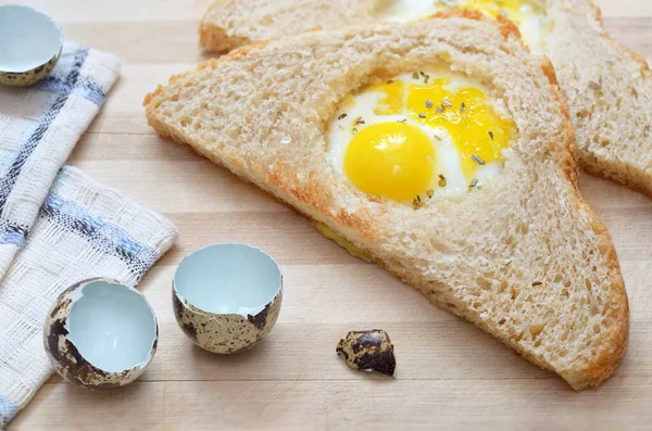 Fried slice of bread with quail egg — Stock Photo, Image