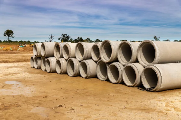 Precast Concrete Drainage pipes stacked up on construction site for new home development