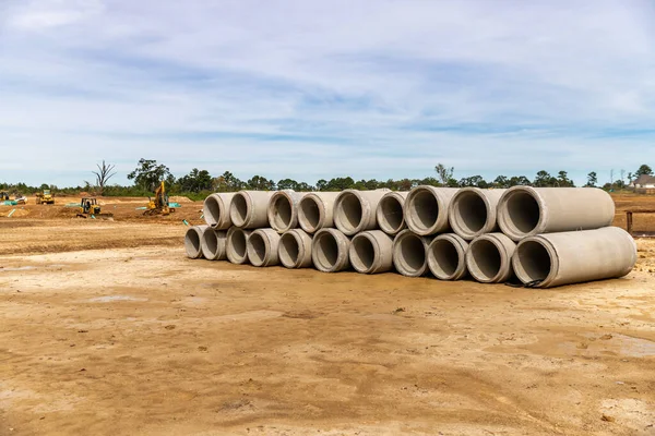 Precast Concrete Drainage pipes stacked up on construction site for new home development