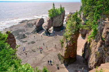 Giant Beautiful rock formations at Hopewell Rocks Park in New Brunswick, Canada - Canadian Travel Destination - Canadian Landscape clipart