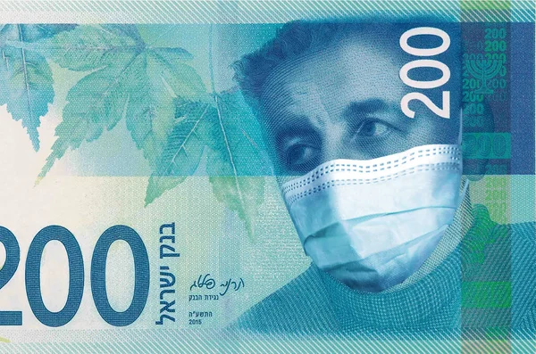 İsrail 'deki koronavirüs salgınının tıbbi bir maskesiyle 200 Şekel İsrail' i finanse ediyor. Coronavirüs salgınının İsrail ekonomisi üzerindeki etkisi. Koronavirüs salgınının etkisi.