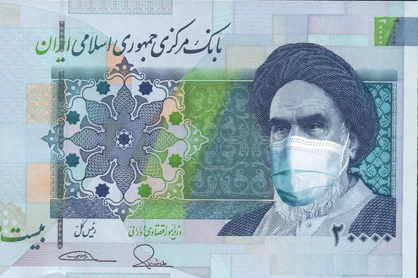 İran 'ın tıbbi maskeli 20,000 reais banknotu. İran 'da koronavirüs salgını. Coronavirüs salgınının İran ekonomisi ve para birimi üzerindeki etkisi