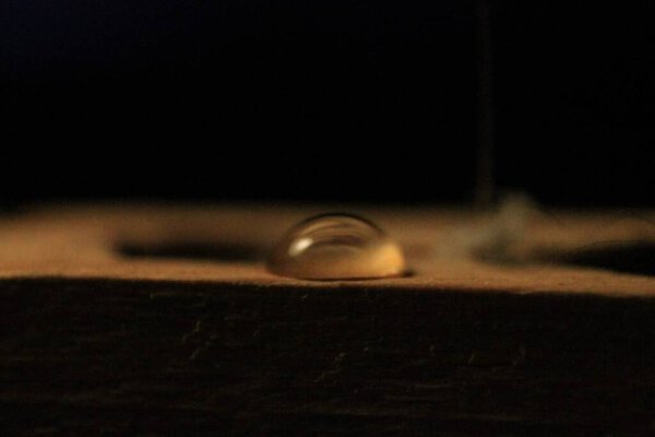 stylish clothespin with a drop refraction of light through a drop of water