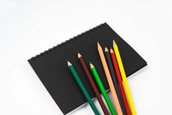 Different Colored Pencil Crayons Scattered Top Isolated Black Paper Diary — Stock Photo, Image