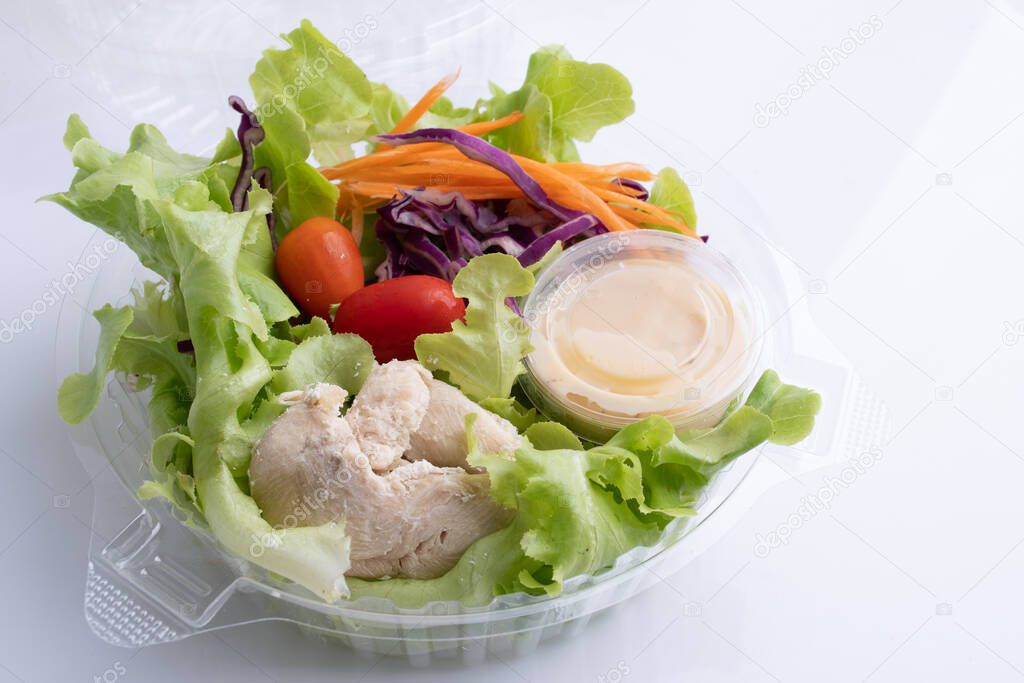Fresh salad with chicken Roast fillet with tomato on white background