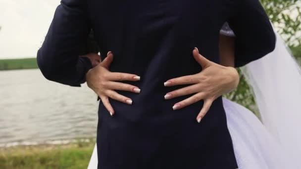Girl White Dress Holds Her Boyfriend Black Suit Ass Hugging — Stockvideo