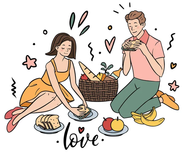 Genç çift biraz meyve ve sandviçle piknik yapıyor.