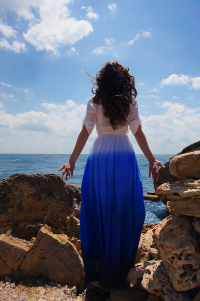 Woman on the beach with blue sky