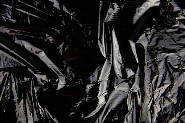 Μαύρη Επαναχρησιμοποιήσιμη Πλαστική Σακούλα Σκούρο Φόντο Για Την Παρουσίαση Της Φωτογραφία Αρχείου