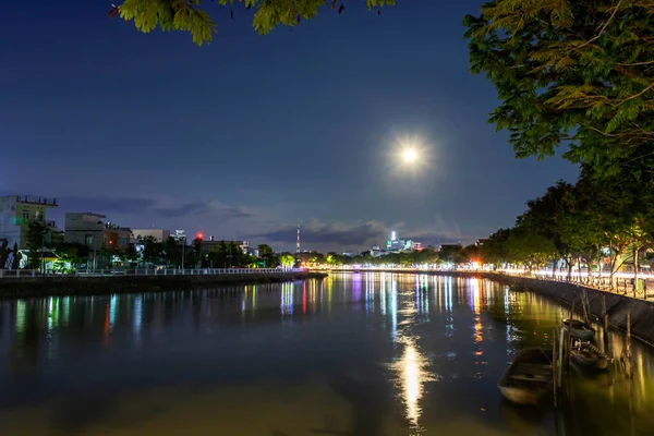 The full moon in the fourth lunar month (May 7, 2020); is the last super moon of 2020; and coincides with Buddha\'s birthday. This photo was taken at the bank of Long Xuyen City, An Giang Province, Vietnam.