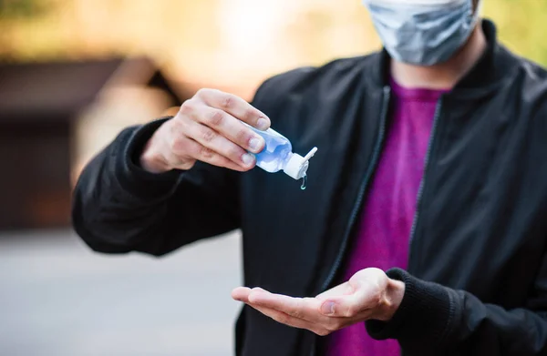 Hands Close Guy Puts Sanitizer His Hands Young Man Holds — Stock Photo, Image