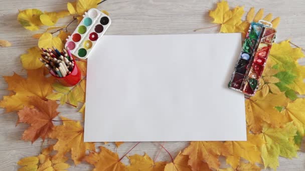 Preparation of the creative work of an autumn afternoon on the wooden table — Αρχείο Βίντεο