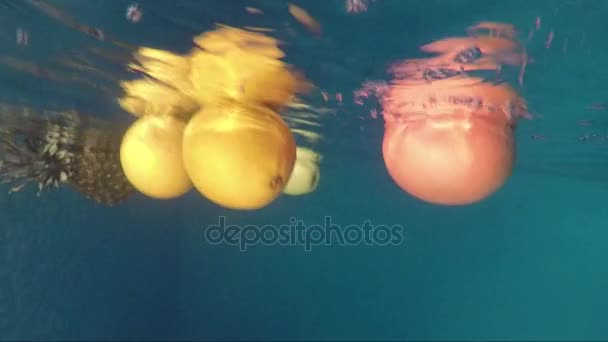 Juicy ripe fruit under water — Stock Video