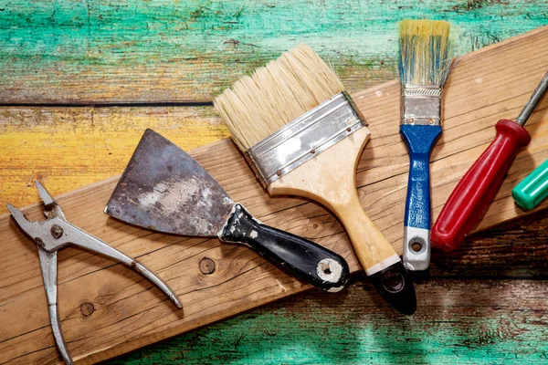 Tools for repair and construction on a wooden background