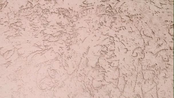 Texture of the wall lined with decorative plaster — Stock Footage Texture of the wall lined with decorative plaster Royalty Free Stock Footage