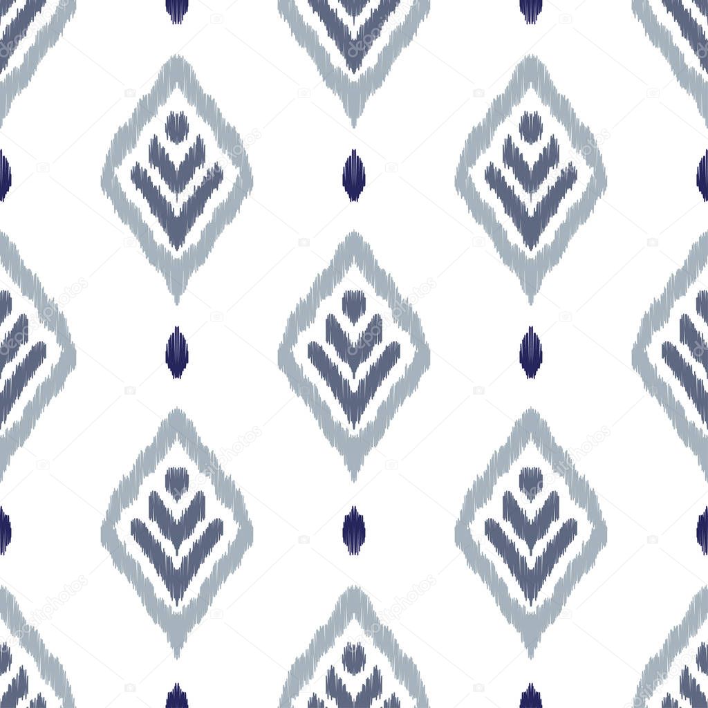 Ikat seamless pattern. Fancy textile design. Vector illustration in ethnic style.