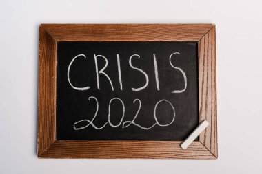 crisis 2020 lettering written on chalkboard on white background, coronavirus concept clipart