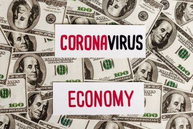 top view of coronavirus and economy cards on dollar banknotes, economic crisis concept clipart