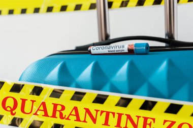 close up view of blue suitcase with coronavirus blood sample in yellow and black hazard warning safety tape with quarantine illustration isolated on white clipart
