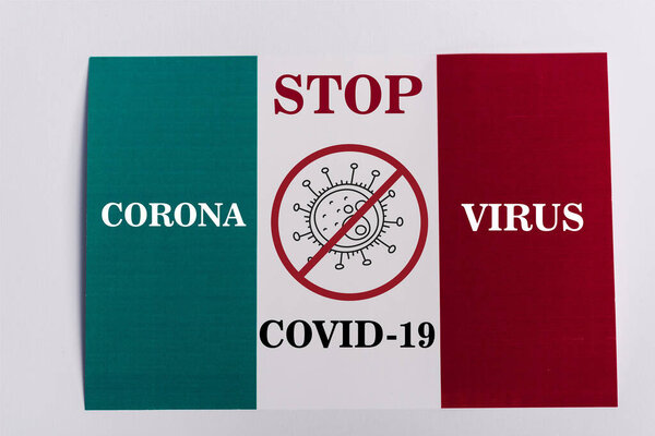 top view of Italian flag on white background, stop coronavirus illustration