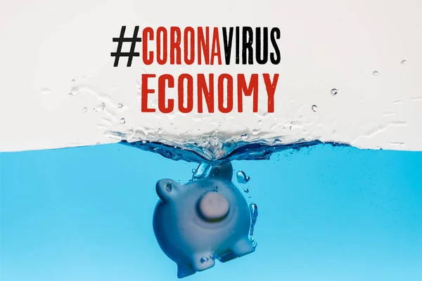 Piggy bank going under blue water with splash isolated on white, coronavirus economy illustration — Stock Photo