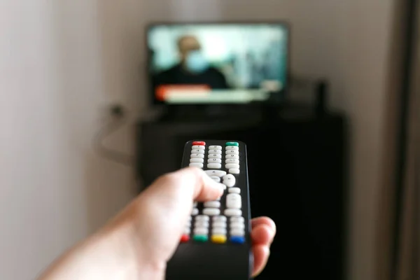 Man Holds His Hand Remote Control Switches Channels Background Television — Stock Photo, Image