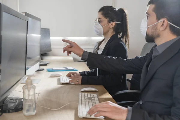 Coronavirus office workers with mask for corona virus. Business workers wear masks to protect and take care of their health. Office working with computer. Working from home.