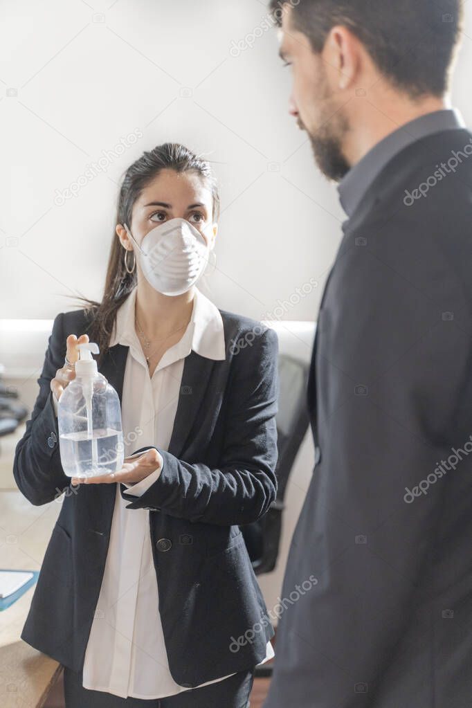 Coronavirus office workers with mask for corona virus. Business workers wear masks to protect and take care of their health. Office working with computer. Working from home. 