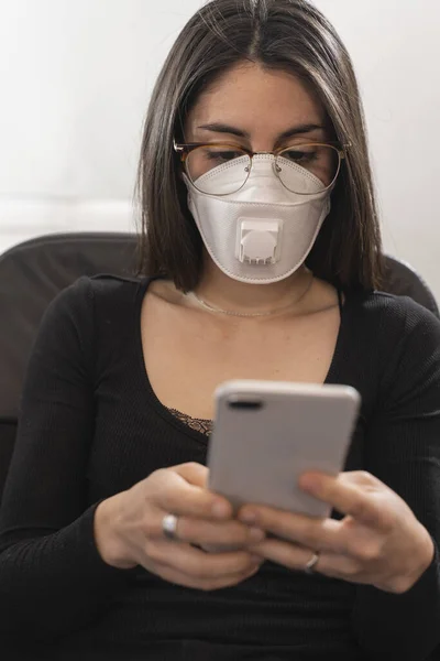 Coronavirus. Woman at the office sick with mask for corona virus. Business women wear masks to protect and take care of their health. Home working with computer. Working from home.