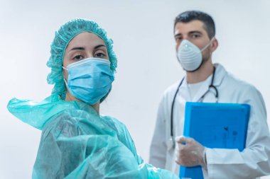 Coronavirus. Hastanede çalışıp koronavirüsle savaşan doktor ve hemşirelere teşekkür ederim. Doktorlar kahramandır. Koruyucu giysili ve maskeli doktorlar hastalığın tedavisini arıyorlar.. 