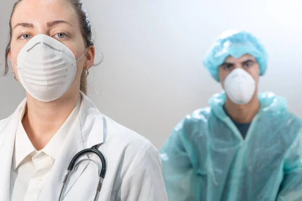 Coronavirus. Portrait of doctors and nurses working in the hospitals and fighting the coronavirus. Doctors are heroes. Doctors in the protective suits and masks looking for a cure for the disease.