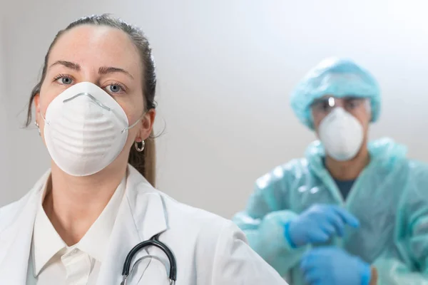 Coronavirus. Portrait of doctors and nurses working in the hospitals and fighting the coronavirus. Doctors are heroes. Doctors in the protective suits and masks looking for a cure for the disease.