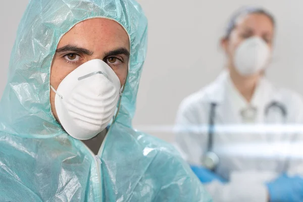 Coronavirus. Portrait of doctors and nurses working in the hospitals and fighting the coronavirus. Doctors are heroes. Doctors in the protective suits and masks looking for a cure for the disease.