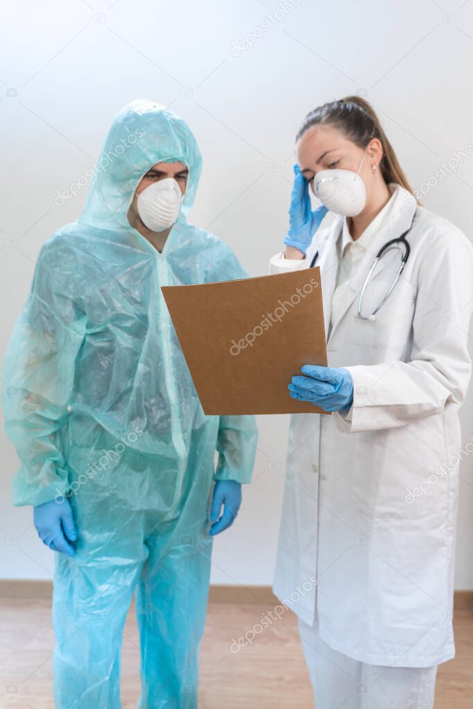 Coronavirus. Portrait of doctors and nurses working in the hospitals and fighting the coronavirus. Doctors are heroes. Doctors in the protective suits and masks looking for a cure for the disease. 