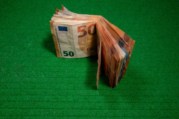 euro banknotes on a green color background