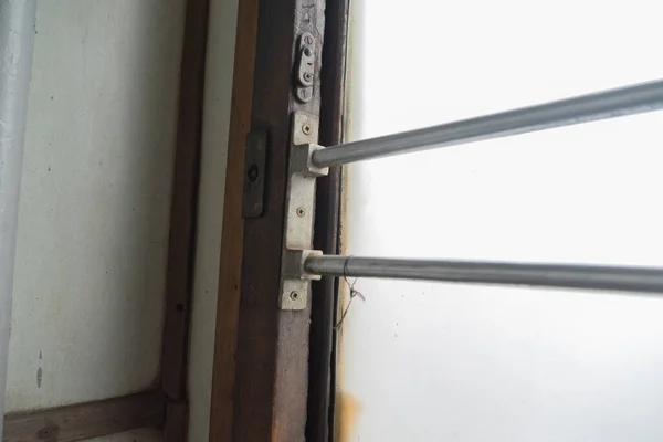 Wooden window frame with a cornice in the reserved seat of the Ukrainian railway