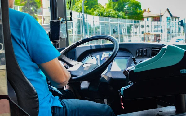 the driver behind the wheel of the bus in Poland