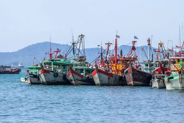 Row of Malaysian fishing boats at the bay close to Kota Kinabalu