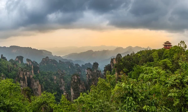 Pagoda on the hill sunset panorama with rocky mountains in the b — Stock Photo, Image