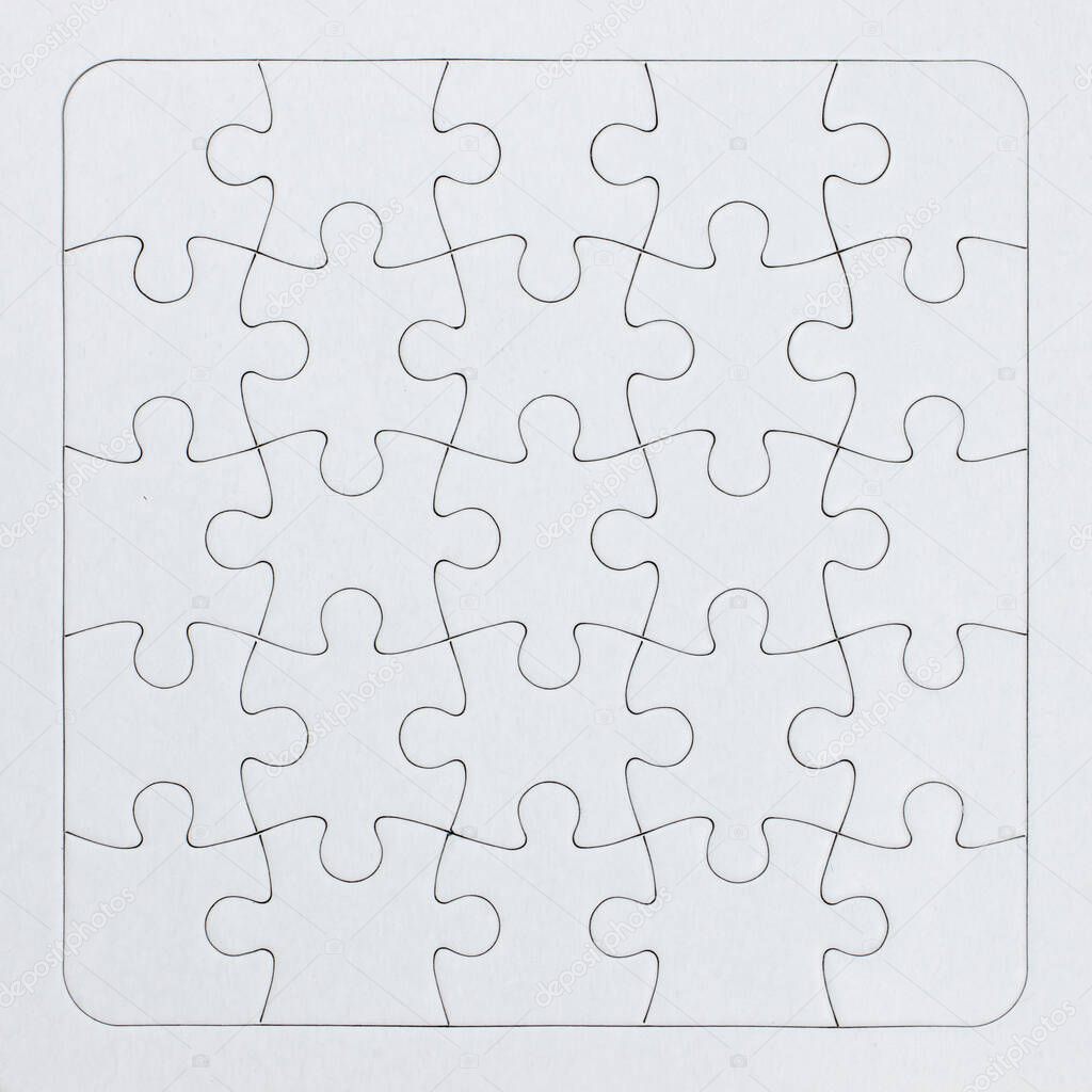 Close-up white jigsaw puzzle with all pieces connected - full frame