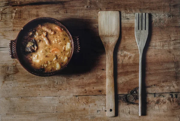 photography traditional food dish lentils with vegetables and blood sausage with chorizo