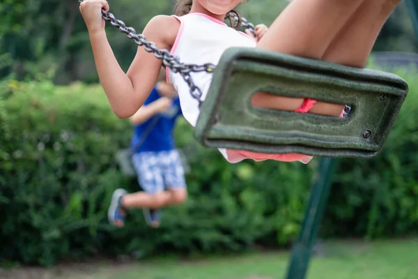 Unrecognizable Kids Swinging Outdoors Playground — Stock Photo, Image