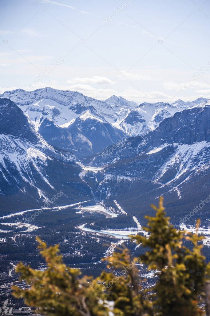 Scenic view of Canmore and Canadian Rockies from the summit of Mount Lady MacDonald, Alberta, Canada