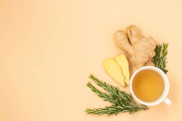 Tea, ginger and rosemary on a light background. Calm, natural colors for relaxation reduce stress, set up for self-care and recovery. Adaptogens improve health and boost the immune system