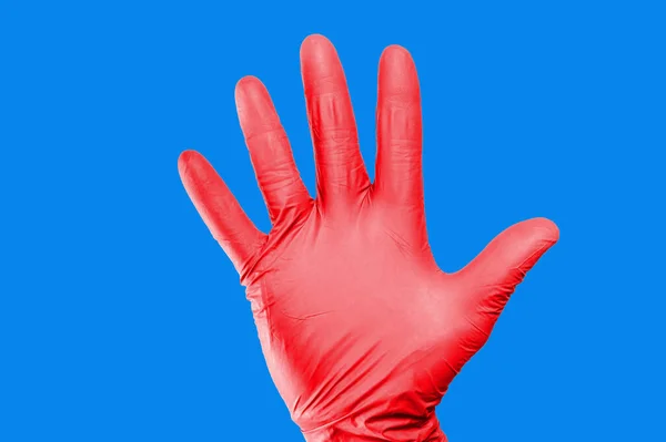 Hand Red Glove Blue Background — Stock Photo, Image