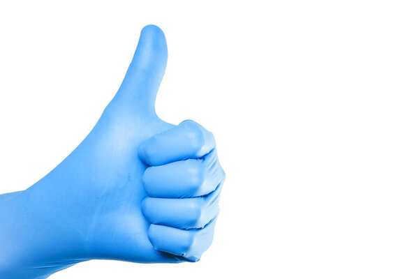Thumb up approval symbol. Hand in blue latex glove isolated on white showing OK sign. Empty copy space medical background. Doctor successful operation. Virus epidemic hygiene glove.