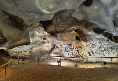 Prehistorical cave with pictures in the walls. Bulgaria clipart