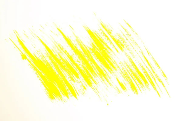 Yellow abstract hand-painted brush stroke daub background over paper — ストック写真